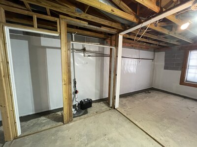 Man knelt down applying waterproofing materials in Atlanta