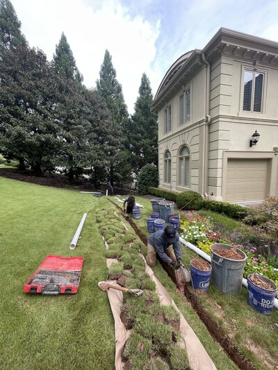 Man knelt down preparing for waterproofing services Atlanta